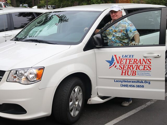 Lacey Veteran's Service Hub white van with driver opening door